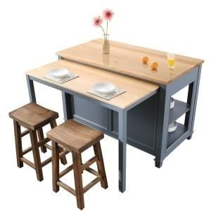 a kitchen table with two stools next to it