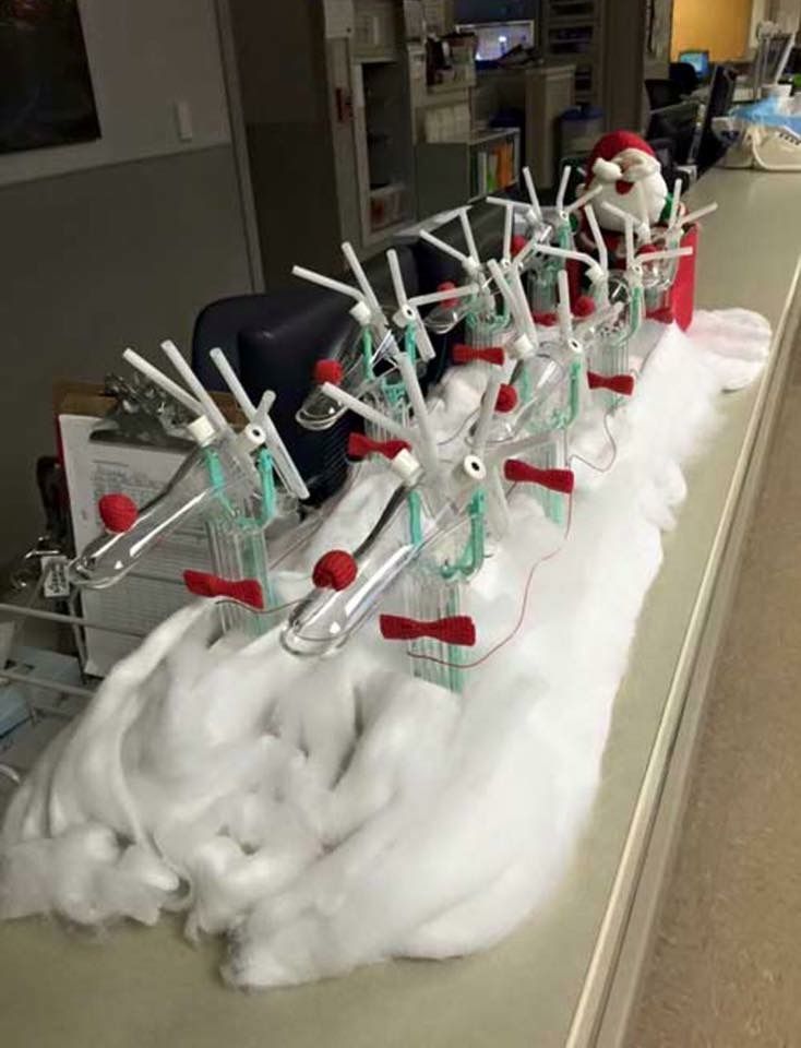 the snow is piled up on the counter in front of the machine and it's red handles