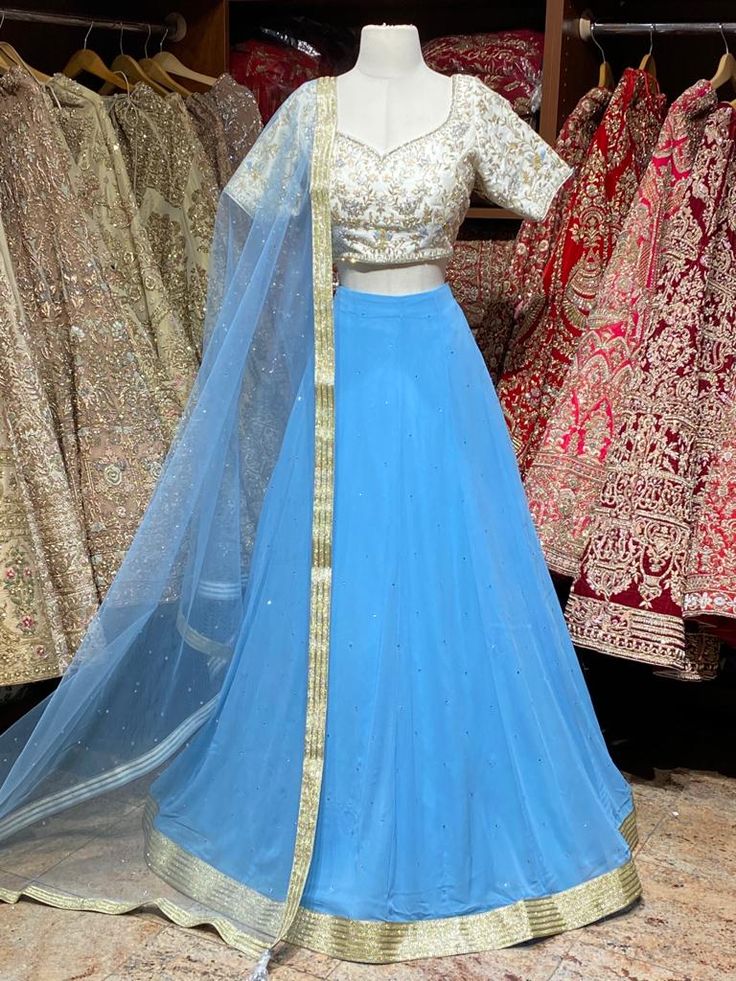 Maya blue stone work lehenga paired with ivory zardozi work blouse and net dupatta. Fabric: Georgette This outfit can be customized in multiple colors and specific to client measurements. 90 days of production time is required and are for bulk orders only! Orders are processed in store only! Final fittings/alterations not included. Minimum Order Quantity- 4 pieces Zardozi Work Blouse, Stone Work Lehenga, Bridesmaids Lehenga, Maya Blue, Bridesmaid Lehenga, Zardozi Work, Work Lehenga, Net Dupatta, Blue Bridesmaids