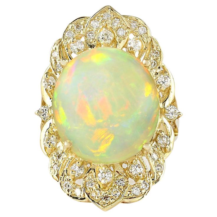 an opal and diamond ring, by bucce & co in yellow gold