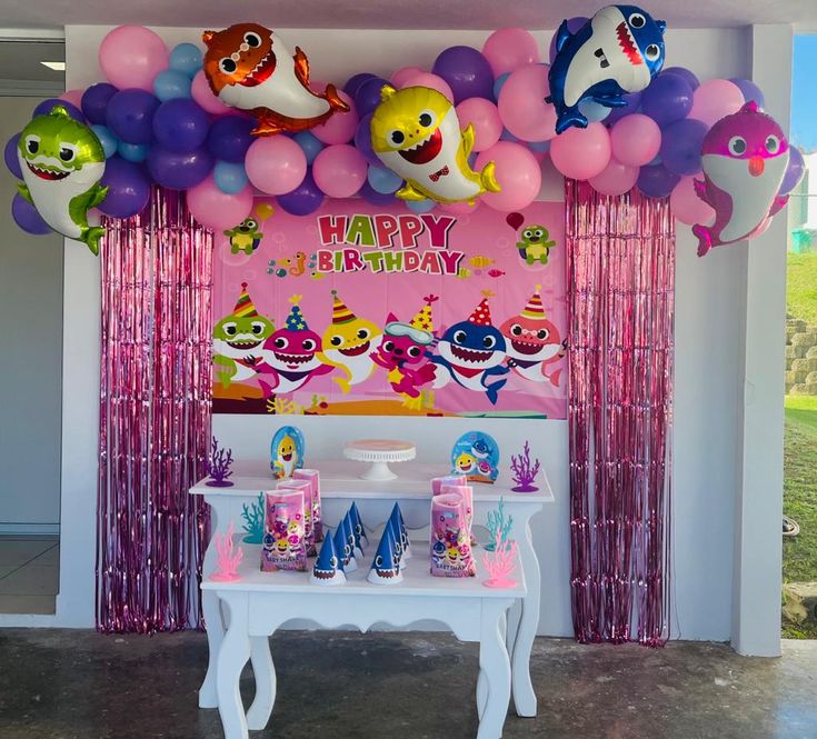 a birthday party with balloons and decorations