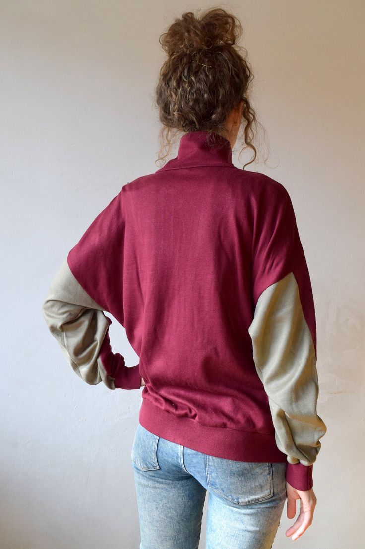 "Bordo workout jacket, vintage bomber, tracksuit, outdoor jacket, 90s activewear, men running jacket, women windbreaker, sports jacket, M/L Vintage bordo workout jacket with gray color block. Jacket has two side pockets and nice high collar to protect you from wind and make you feel cosy! Size: given GB 16, seems like women (L) and men (M) PLEASE CHECK ALL MEASUREMENTS BELLOW: Length: 63 cm/ 25\" Shoulder to shoulder: 64 cm/ 25\" Sleeves: 50 cm/ 20'' Chest: 122 cm/ 48\" Condition: excellent Fabr Oversized Sports Track Jacket, Athleisure Long Sleeve Fleece Jacket For Streetwear, Oversized Long Sleeve Track Jacket For Sports, Sportswear Track Jacket With Relaxed Fit And Long Sleeves, Sporty Hoodie With Elastic Cuffs For Streetwear, Relaxed Fit Long Sleeve Track Jacket, Oversized Sporty Track Jacket With Ribbed Cuffs, Sporty Oversized Track Jacket With Ribbed Cuffs, Oversized Cotton Sporty Varsity Jacket