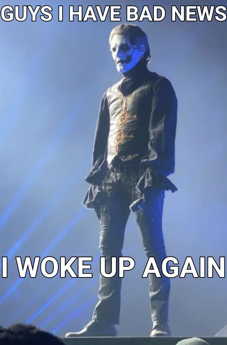 a man with blue paint on his face standing in front of a microphone and text that reads guys i have bad news i woke up again