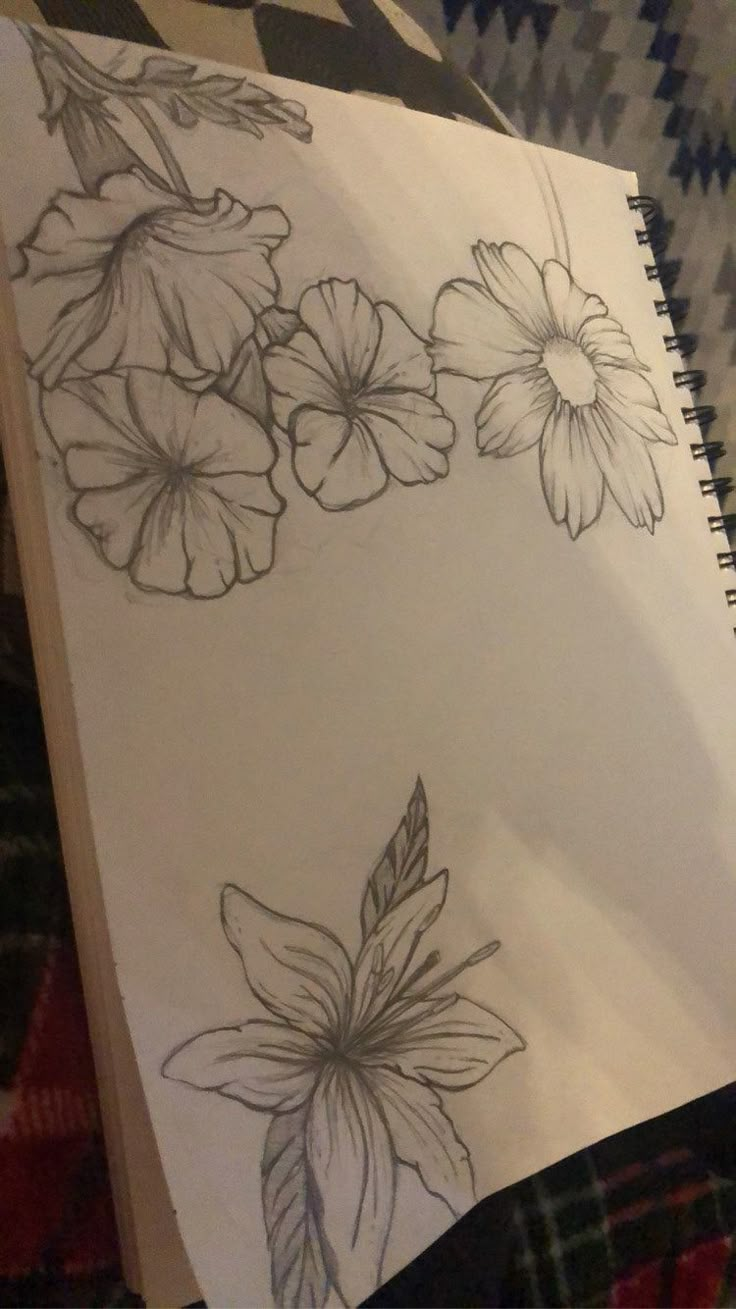 a drawing of some flowers on a piece of paper