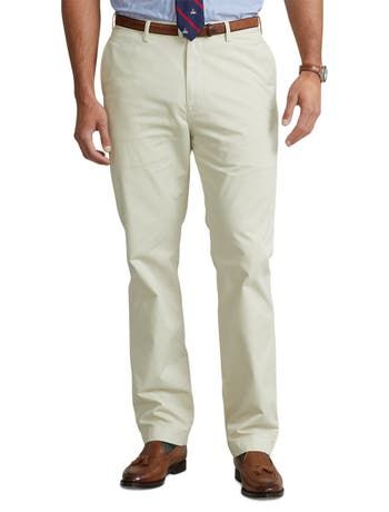 Ultra-soft stretch cotton and a relaxed fit make these chinos from Polo Ralph Lauren a comfortable classic you’ll wear again and again.97% cotton/3% elastaneFlat-front style Zip fly with a buttoned closureBelt loopsSide pockets, right hip coin pocket, back left buttoned pocket, back right button-and-loop pocket  Signature embroidered Pony above the back right pocketSize 46W has a 12½" rise and a 19½" leg openingDue to the natural characteristics of this material, the coloring may rub off onto fa Spring Straight Fit Cotton Chinos, Spring Cotton Chinos With Straight Fit, Spring Cotton Straight Fit Chinos, Casual Cotton Pants For Business Casual, Solid Cotton Straight Dress Pants, Casual Slim Fit Chinos In Chino Cotton Twill, Casual Business Chino Cotton Twill Dress Pants, Casual Chino Cotton Twill Straight Dress Pants, Casual Straight Chino Cotton Twill Chinos