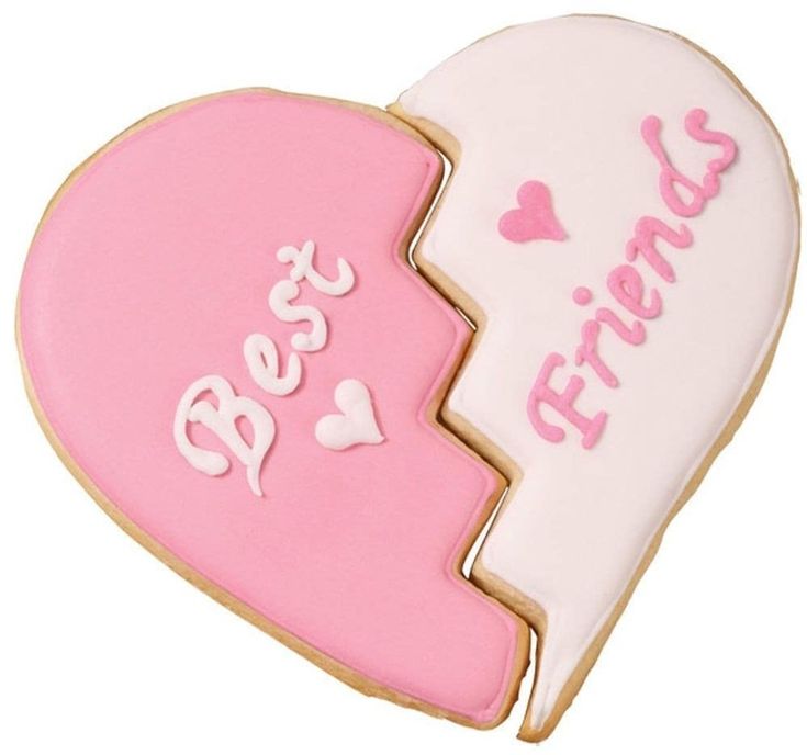 two heart shaped cookies with the words best friends written in white and pink frosting