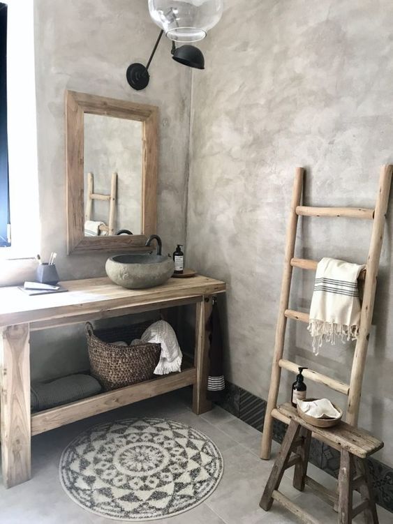 a bathroom with a ladder, sink and mirror