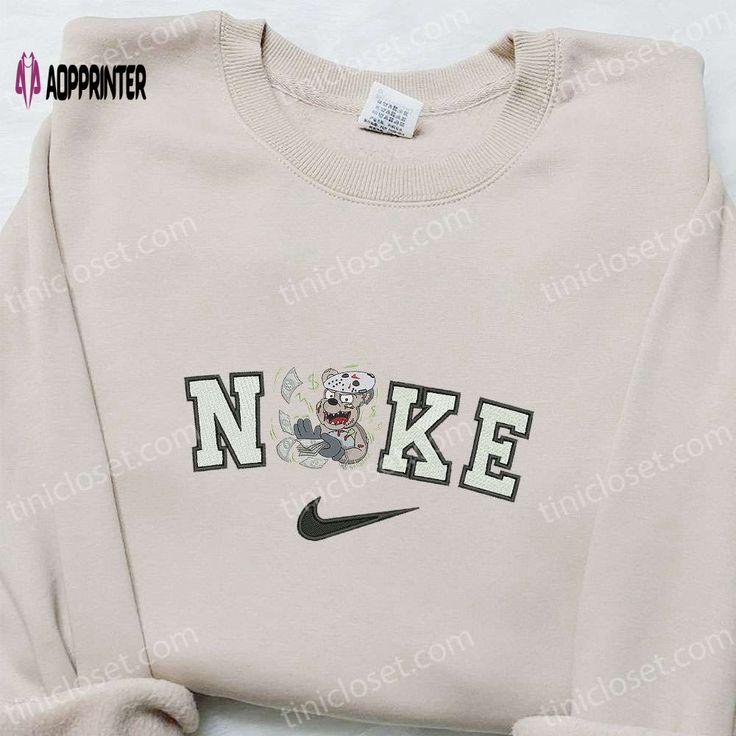 The Nike x Scary Bear Jason Voorhees Embroidered Shirt combines the iconic Nike logo with the chilling allure of Jason Nike Cartoon, Nike Inspired, Best Family Gifts, Maroon Hoodie, Hoodie Material, Custom Nikes, Nike Sweatshirts, Embroidered Clothes, Embroidered Sweatshirt