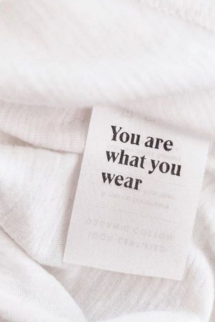 a white t - shirt with the words you are what you wear on it