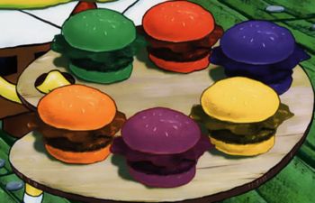 there are many different colored hamburgers on the table