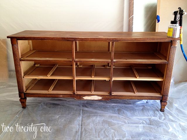 an old wooden cabinet is being worked on