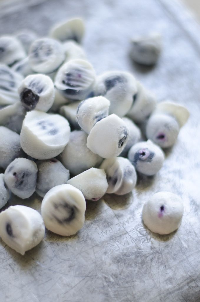 small pieces of white and black food sitting on top of a table