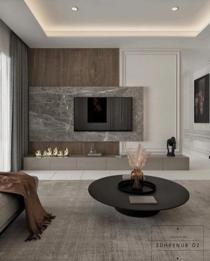 a modern living room with white walls and wood paneling on the wall, black coffee table