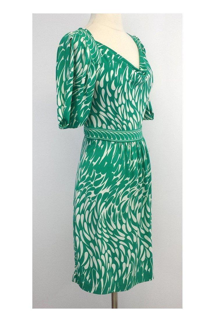 Size Small Green & White Print Dress Body 94% Polyester 6% Spandex Slips on Cowl neck Rushing on back of waist Flared skirt Underarm to underarm 31" Waist 26" Roomy hip area Total length 34.5"