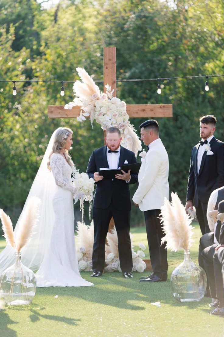 End of altar wedding cross with pampas and dried florals Cross Arches For Wedding, Boho Wedding Cross Decor, Cross Altar Wedding, Cross Wedding Alter, Cross Wedding Arch, Wedding Cross Altar, Calla Lillies Wedding, Cross Altar, Wedding Pampas