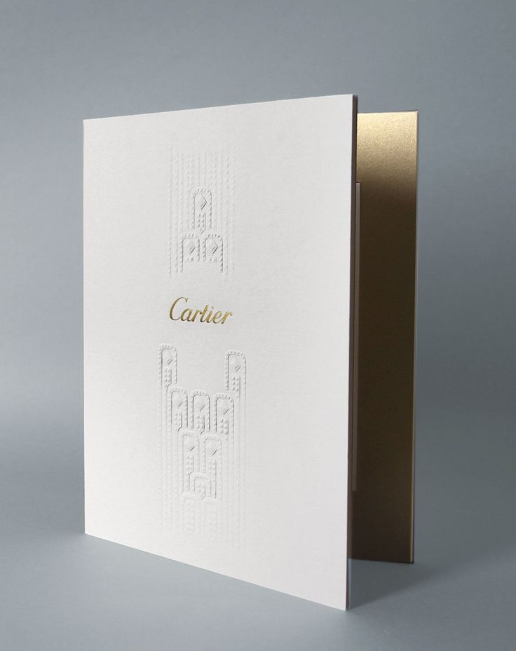 a white card with gold foil on it