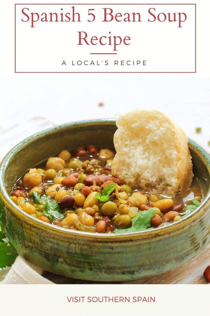 the spanish 5 bean soup recipe is shown in a bowl with bread on the side