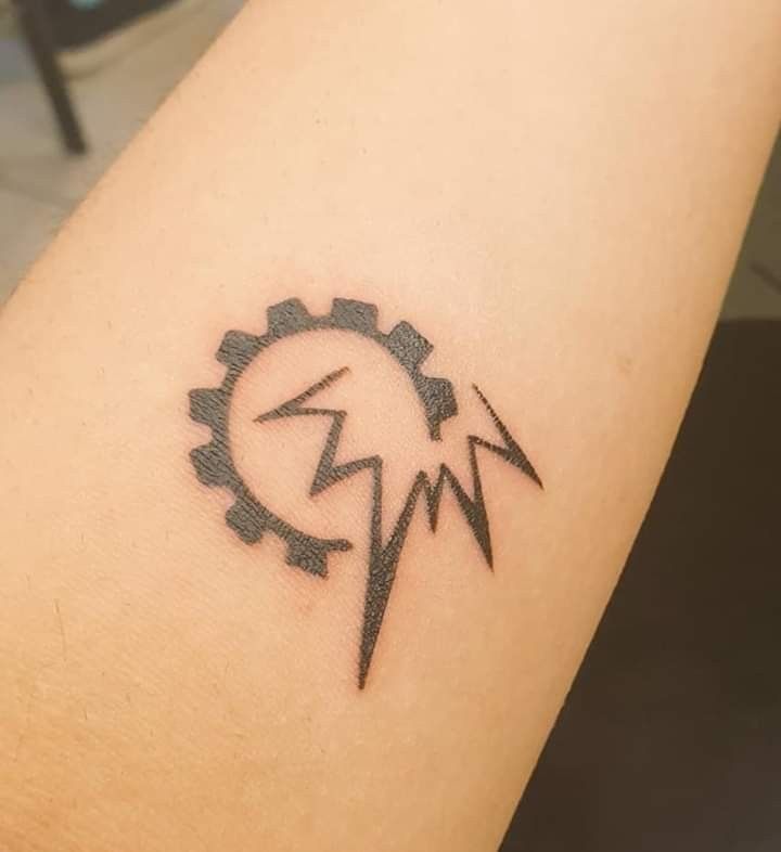 a tattoo on the arm of a person with a clock and lightning bolt in it