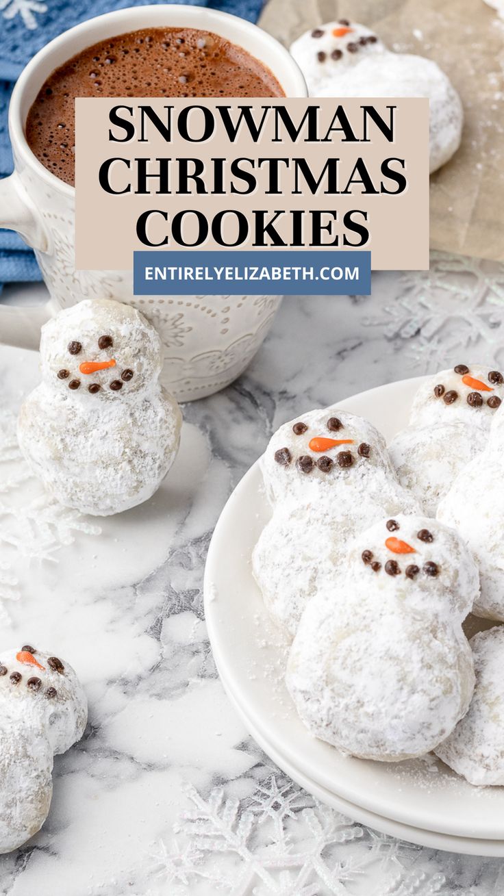 snowman christmas cookies on a white plate next to a cup of coffee and napkins