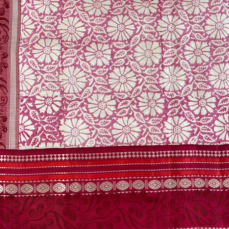 Explore the beauty of traditional handwoven korvai kanjivaram silk saree. Crafted by hand block printed with azo-free dyes, this saree features a white base with pink floral body with red border and pallu. Accented with hand screen print, this elegant piece will make a timeless addition to your wardrobe. Approximate Length 6.5 mtrs (inclusive of blouse length) Approximate Height - 46 - 50" Approximate weight - 1.7 lbs Saree comes with fall, picot and tassels done when applicable. Blouse piece is cut. Kindly Note : The colors you see on your device may vary due to the color reproduction, brightness and resolution of individual devices. If you'd like more clarity before your purchase, please contact our support team. Pink Dupatta With Block Print In Traditional Drape, Traditional Pink Saree With Block Print, Pink Block Print Saree For Diwali, White Banarasi Silk Dupatta With Border, White Art Silk Dupatta With Border, White Silk Dupatta With Printed Motifs, Red Saree With Printed Motifs For Wedding, Red Wedding Saree With Printed Motifs, White Saree With Block Print In Traditional Drape