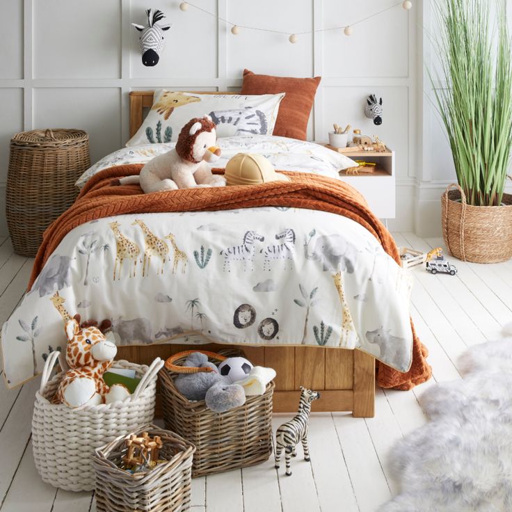 a bed room with a neatly made bed and stuffed animals