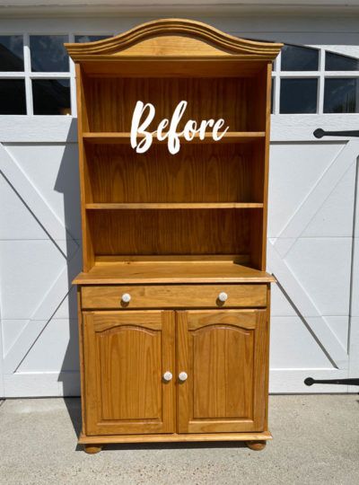 a wooden hutch with the word before painted on it