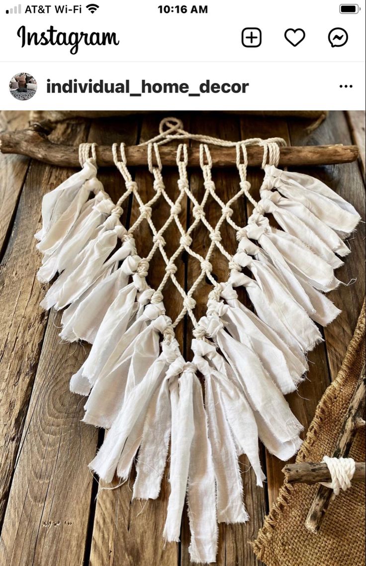 an image of a white dream catcher on a wooden floor with text that reads instagramm