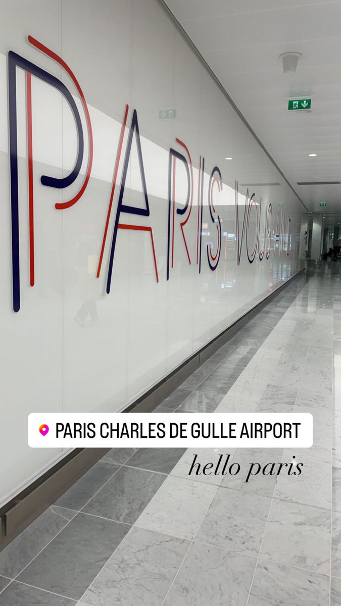 the entrance to paris charles de gulle airport is painted with red, blue and black letters