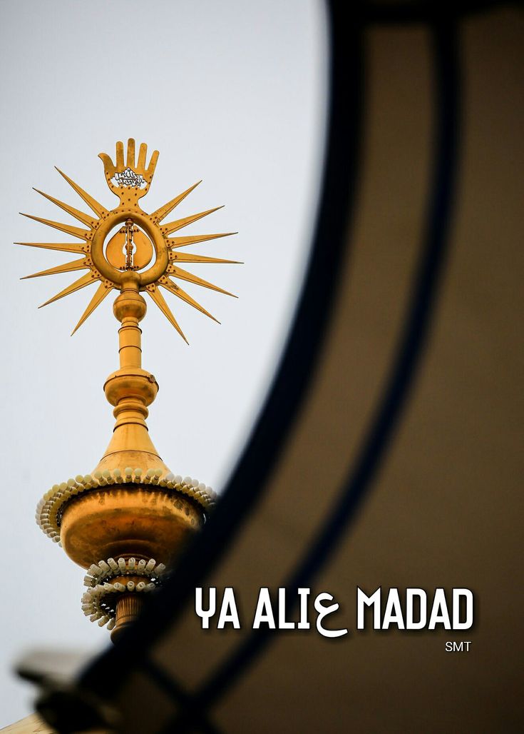 the top of a building with a gold clock on it