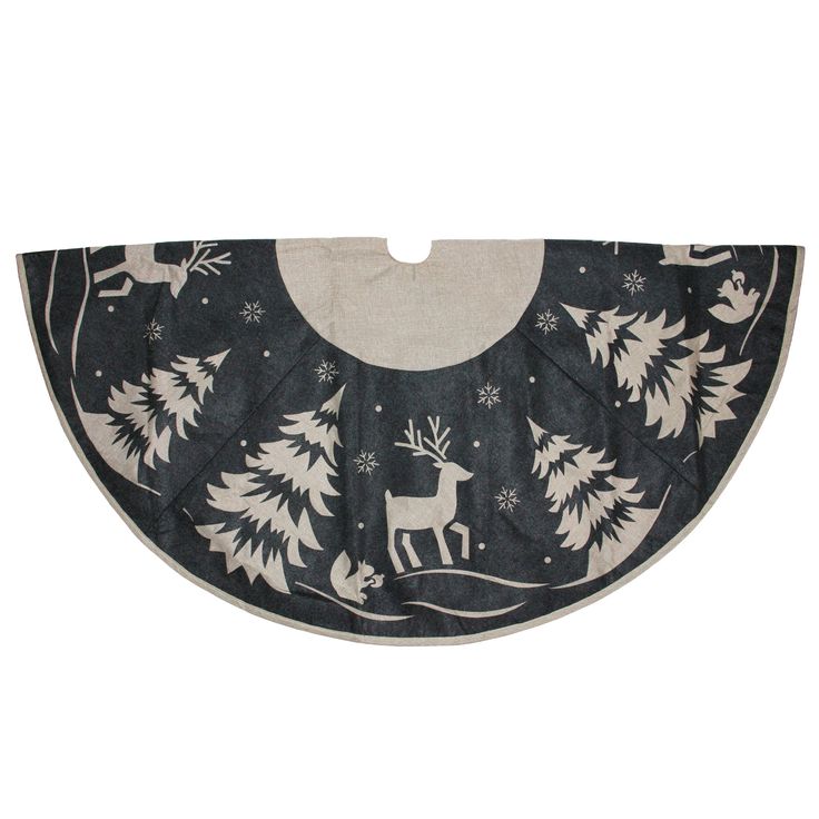 a black and white christmas tree skirt with reindeer on it