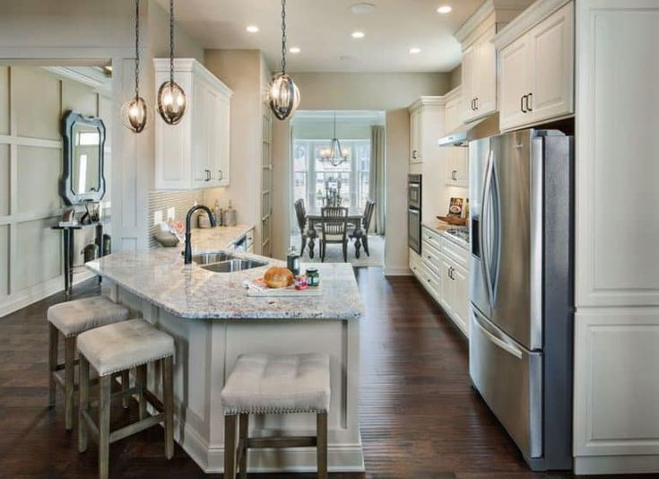 a large kitchen with an island in the middle