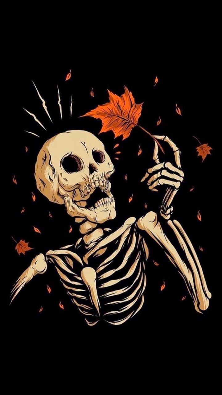 a skeleton holding an orange leaf in it's hand