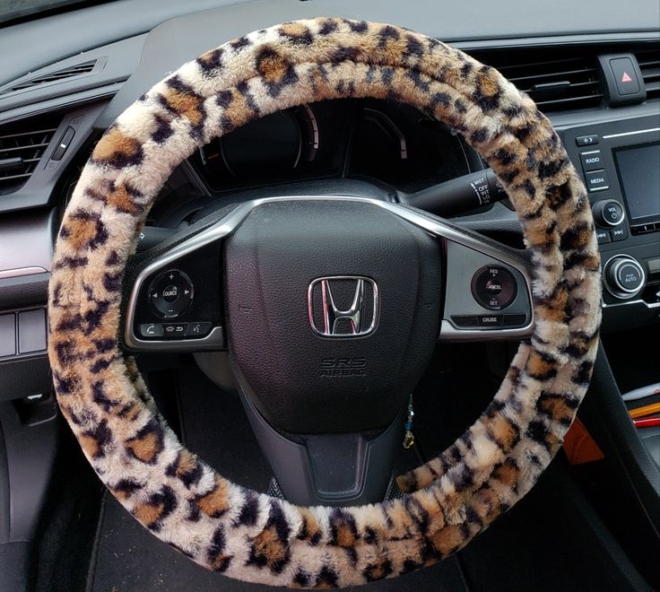 the steering wheel cover is decorated with leopard print