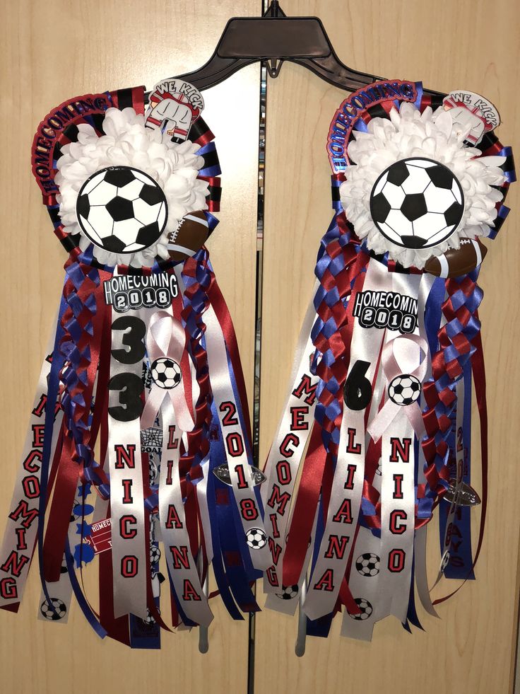 two door hangers decorated with ribbons and soccer balls