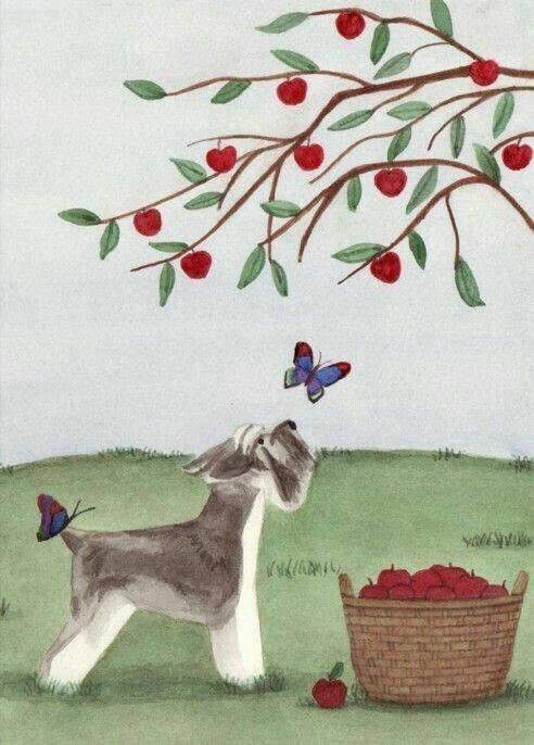 a dog standing next to a basket full of apples under a tree with butterflies on it