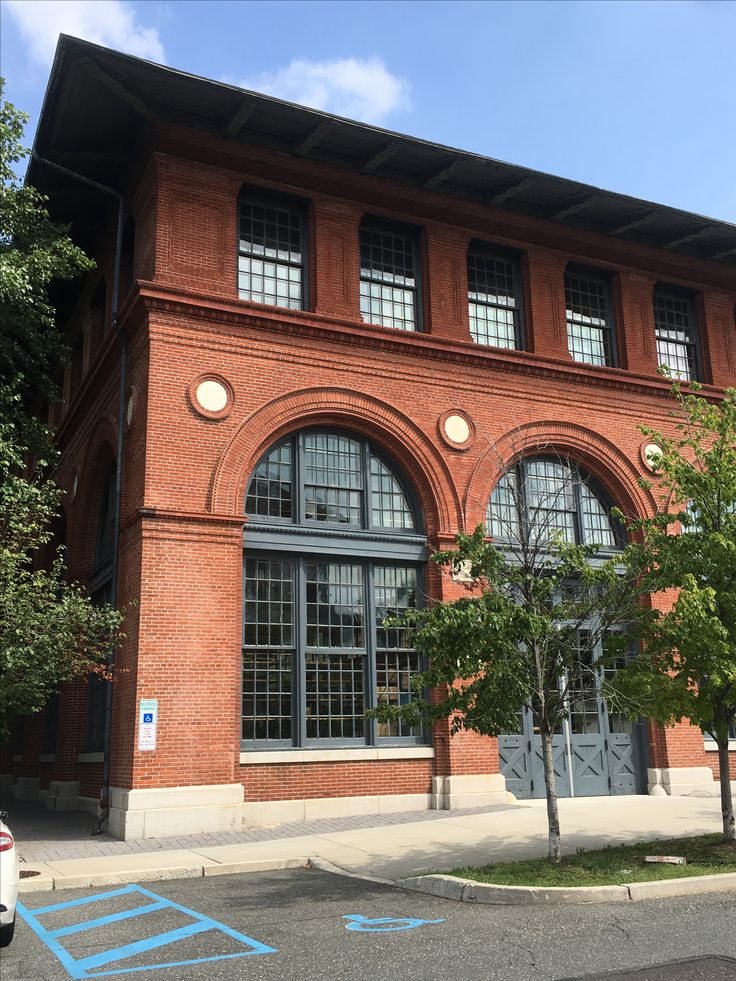 an old brick building with many windows on it