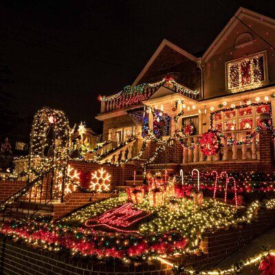 a house covered in christmas lights and decorations