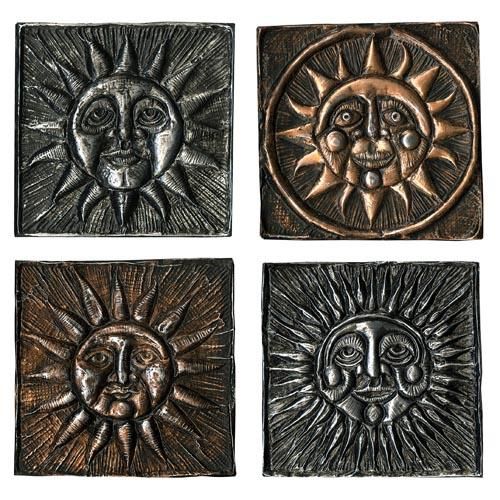 four metal sun and moon wall plaques in various styles, each with different faces on them