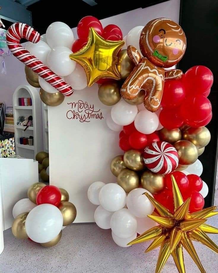 balloons and decorations are on display at a christmas party