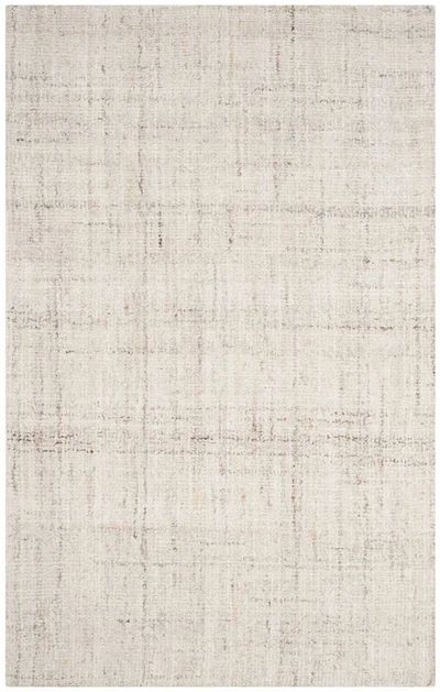 an area rug with white and beige colors