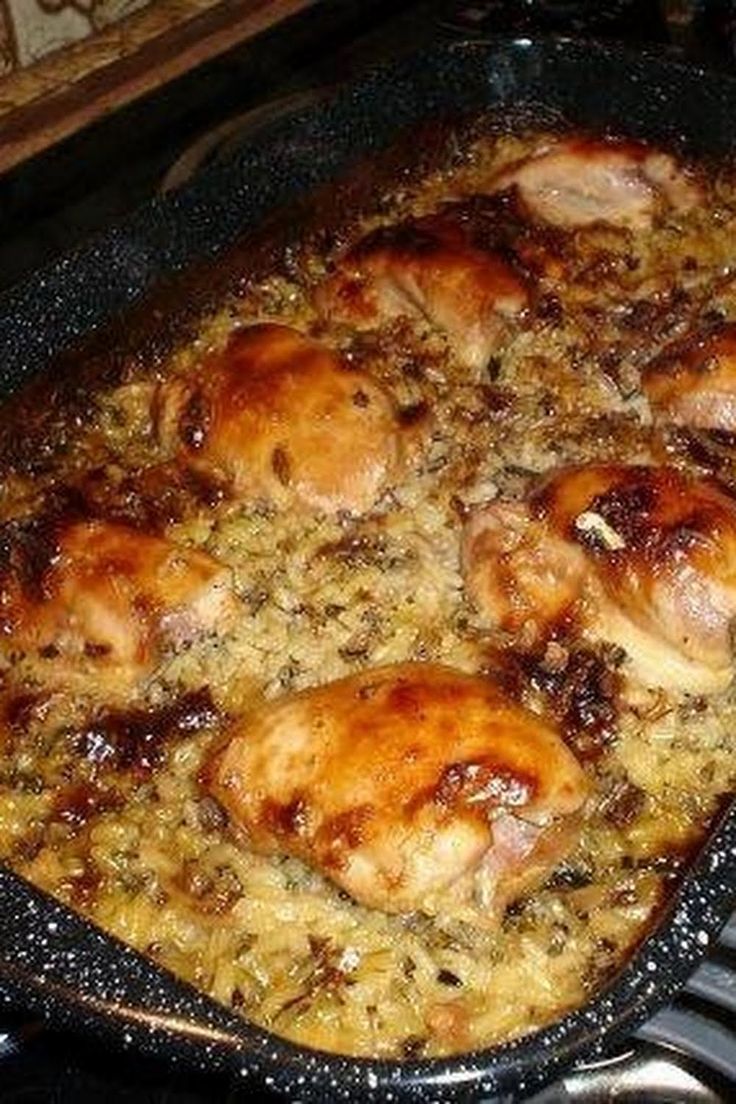 chicken and rice casserole in a pan on the stove with words saying no peek chicken