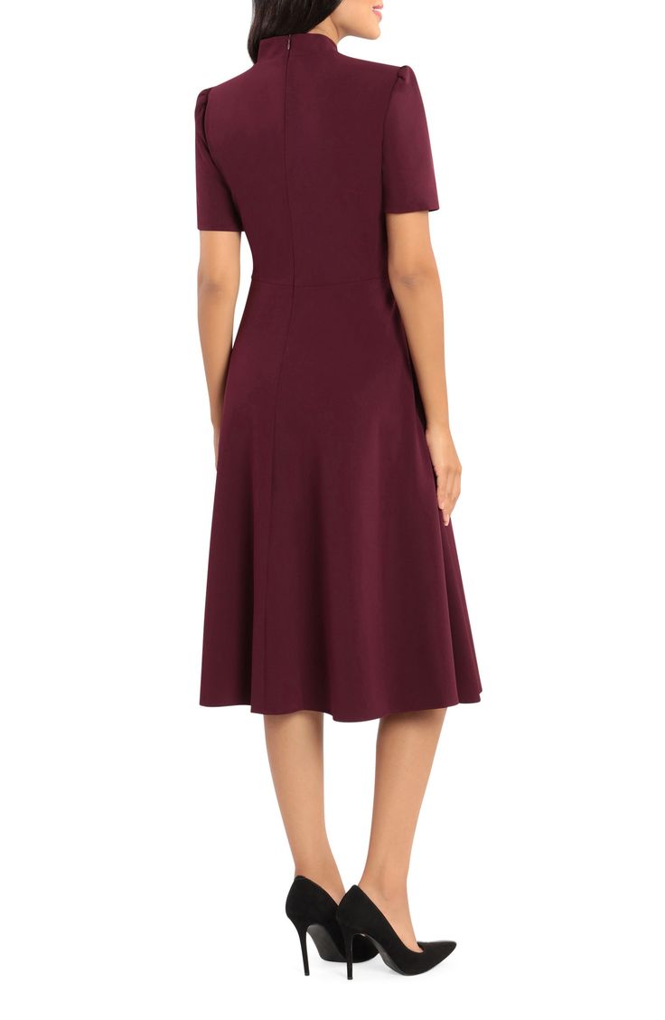 This dainty short sleeve dress is a retro inspired staple that's perfect for any well-dressed occasion. 45" length Necktie Short sleeves Back zip closure Lined 96% polyester, 4% spandex Hand wash, dry flat Imported Model Stats: 5'10" height; 34" bust; 27" waist; 35" hips. Solid Color Non-stretch Short Sleeve Dress, Knee-length Business Dress With Hidden Button Closure, Flattering Short-sleeved Elastane Midi Dress, Knee-length Rayon Midi Dress With Button Closure, Black Knee-length Midi Dress With Gathered Sleeves, Maggy London, Retro Inspired, Well Dressed, Neck Tie