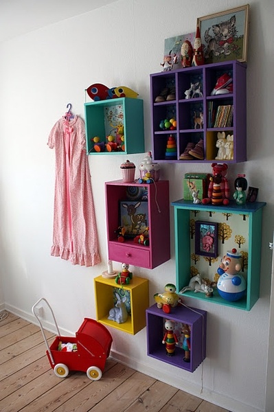 colorful shelves with toys on them against a white wall