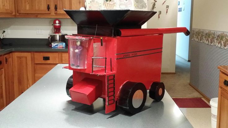 a red toy truck sitting on top of a kitchen counter