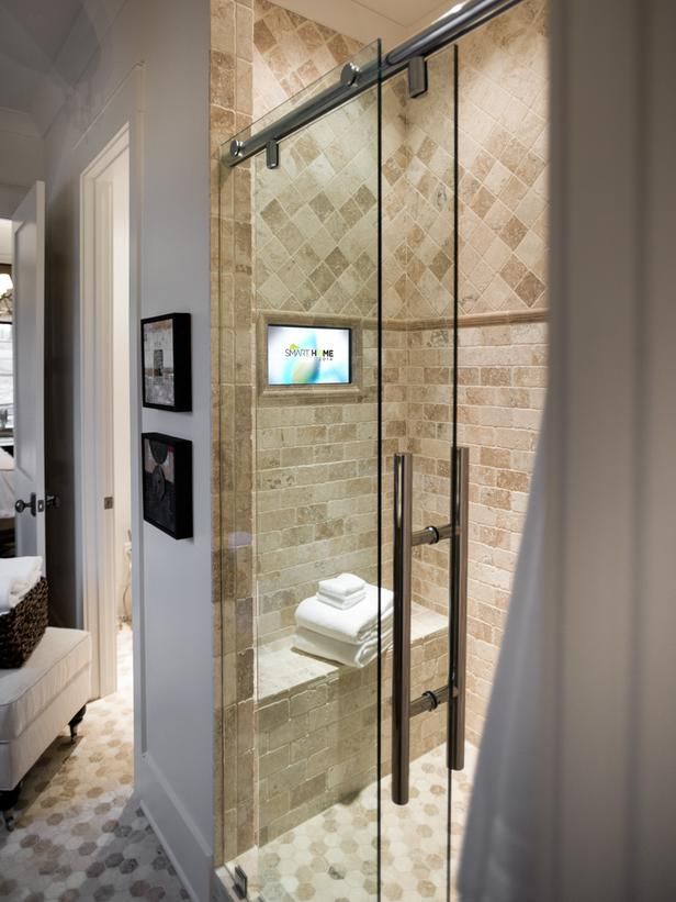 a bathroom with a walk in shower next to a sink