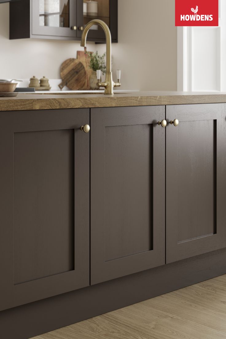 an image of a kitchen setting with wood flooring and brown cabinetry in the background