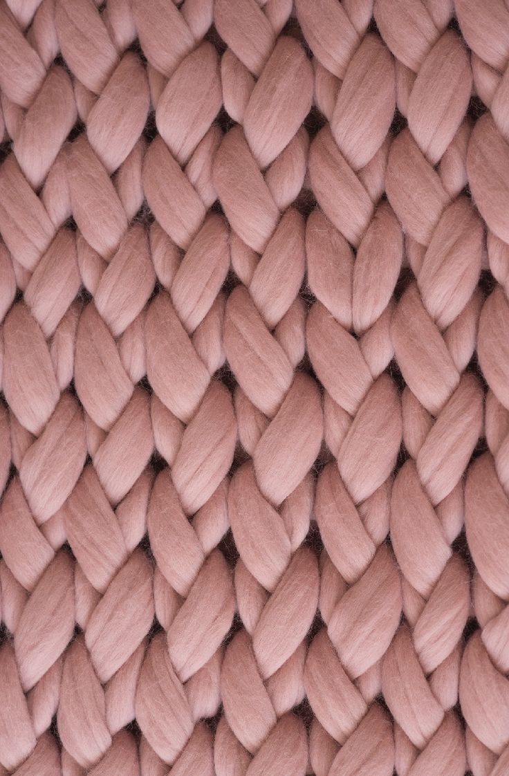 the texture of an upholstered blanket is pink