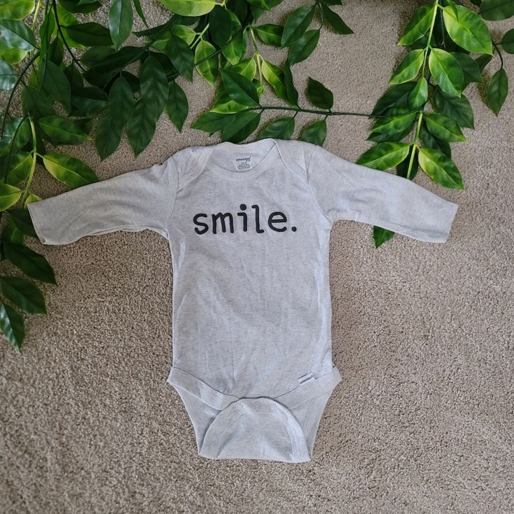 Bnwot Unisex Onesie With The Word "Smile" Printed On The Front Cute Casual And Simple Onesie Heather Gray Color Perfect For A Parent With A Kid That Loves Smiling(: #Babyclothes #Infant #Unisex #Onesies #Genderneutral Cute Gray Cotton Onesie, Gray Long Sleeve Cotton Onesie, Gray Cotton Onesie For Playtime, Onesie Decorating, Smile Word, Kids Onesies, Unisex Onesies, Month Colors, Baby Prints