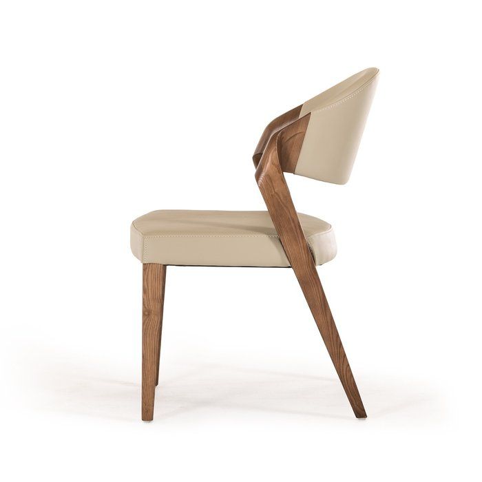 an upholstered chair with a wooden armrest and seat cushion in beige fabric