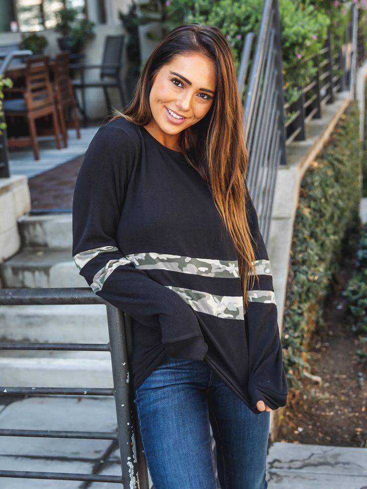 Introducing the Ruby Pullover - the perfect addition to your wardrobe! This soft and cozy pullover will keep you warm and stylish all season long. The bold print adds a touch of fierceness to any outfit, while the classic stripes make it versatile enough for any occasion. Size: Small 0-4 Medium 6-8 Large 10-12 XL 12-14 Winter Black Top With Contrast Stripes, Black Winter Top With Contrast Stripes, Black Tops With Contrast Stripes For Winter, Fall Layering Sweater With Striped Sleeves, Fall Striped Sleeve Sweater For Layering, Black Casual Sweatshirt With Contrast Stripes, Trendy Striped Sweatshirt For Fall, Black Sweater With Striped Sleeves For Winter, Black Sweater With Striped Long Sleeves